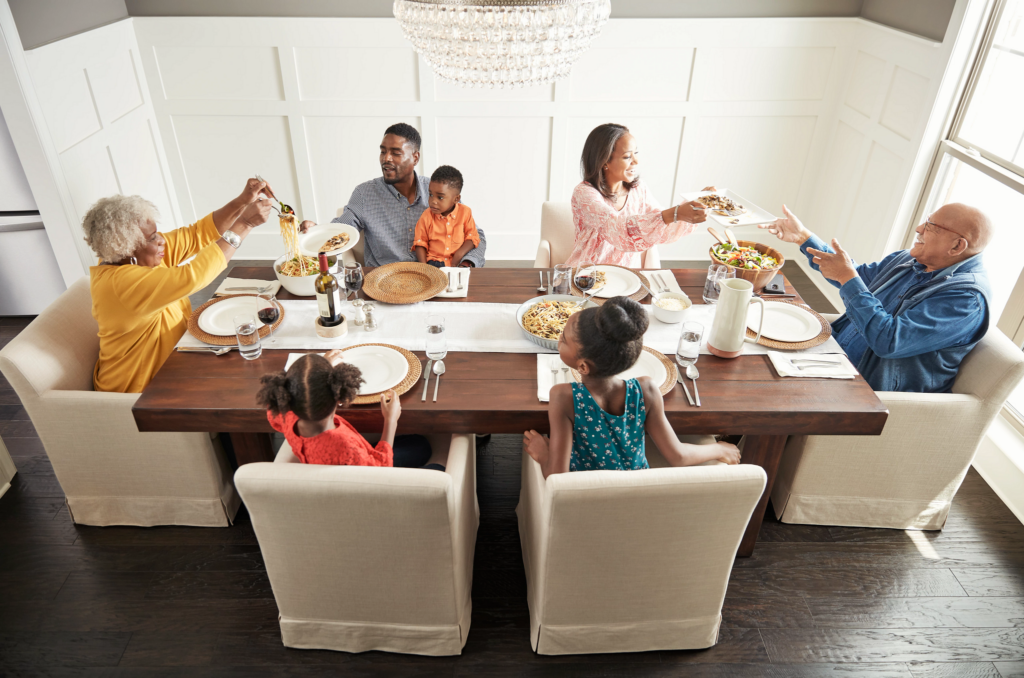 Family having breakfast at the dining table | Price Flooring